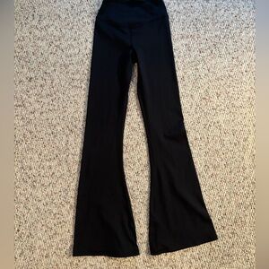 Shop Talulah - butter soft flared leggings with crossed waist band